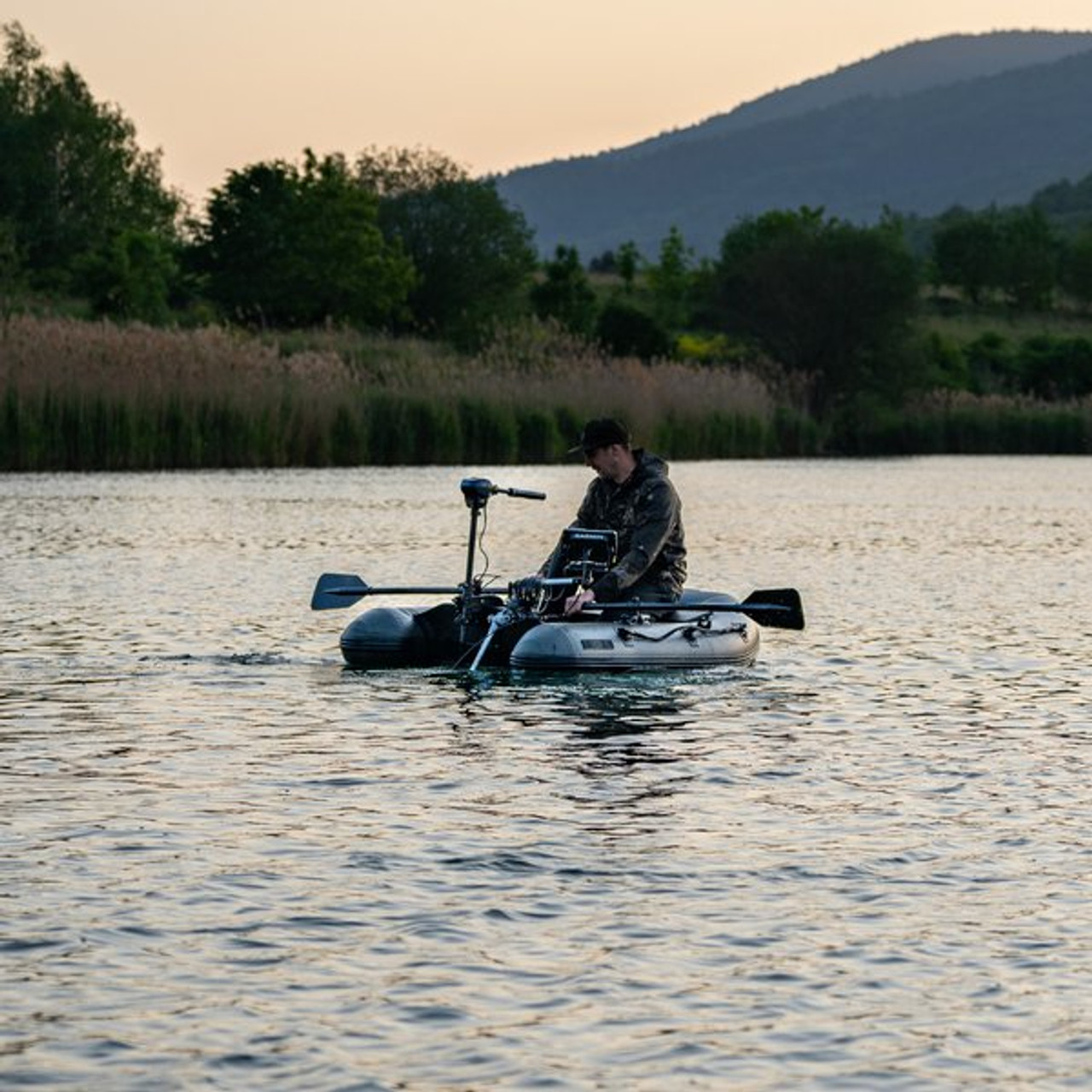 A fisherman in an inflatable boat